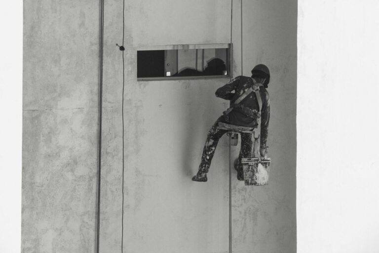 high rise building painter in action aracaju