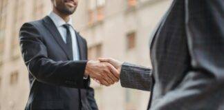 two people shaking hands