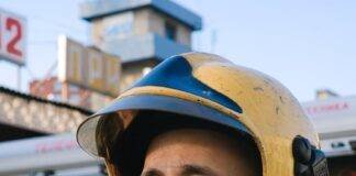 portrait of firefighter in uniform and helmet
