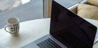 macbook pro on white table