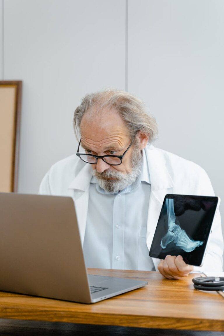 doctor holding a scan of a foot