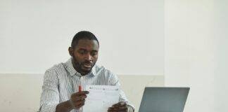 a man looking at the test paper