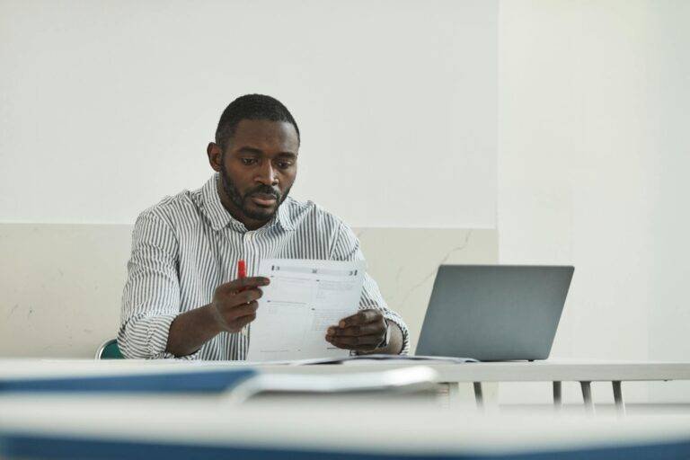 a man looking at the test paper