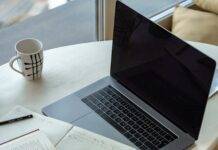 macbook pro on white table