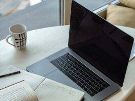 macbook pro on white table