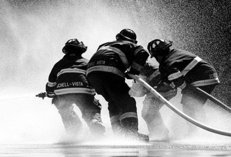 grayscale photo of firemen