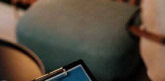 person holding black ipad with black case